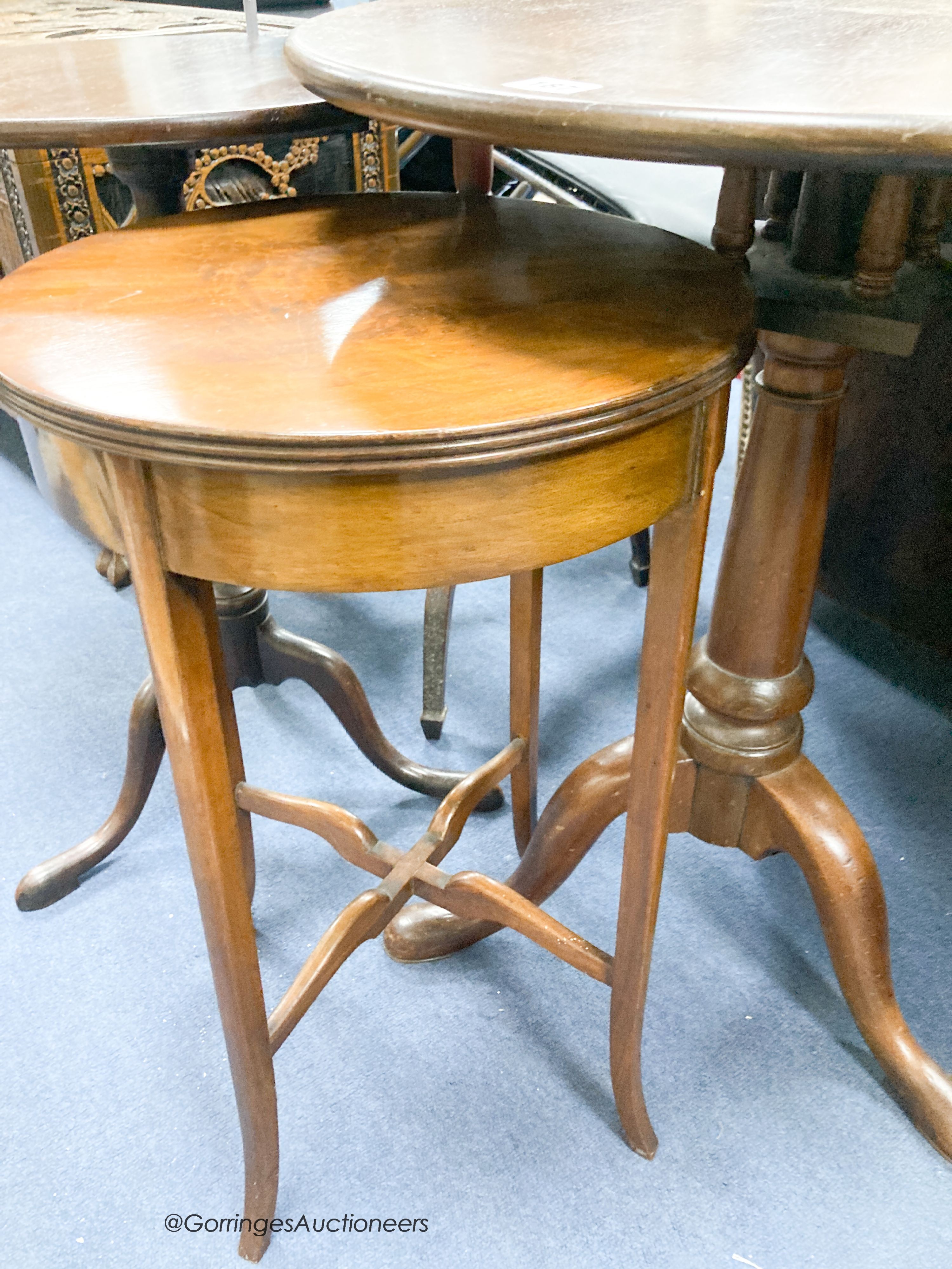 Three George III and later circular mahogany tripod tables, largest diameter 60cm together with a 1920's walnut circular occasional table